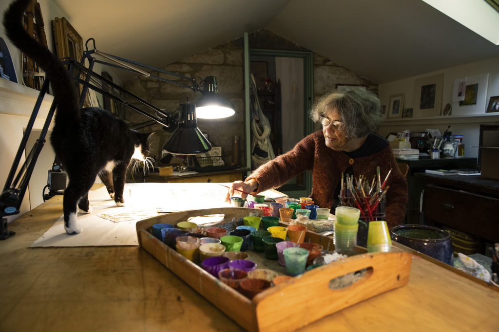 Audrey Christie in her studio with cat